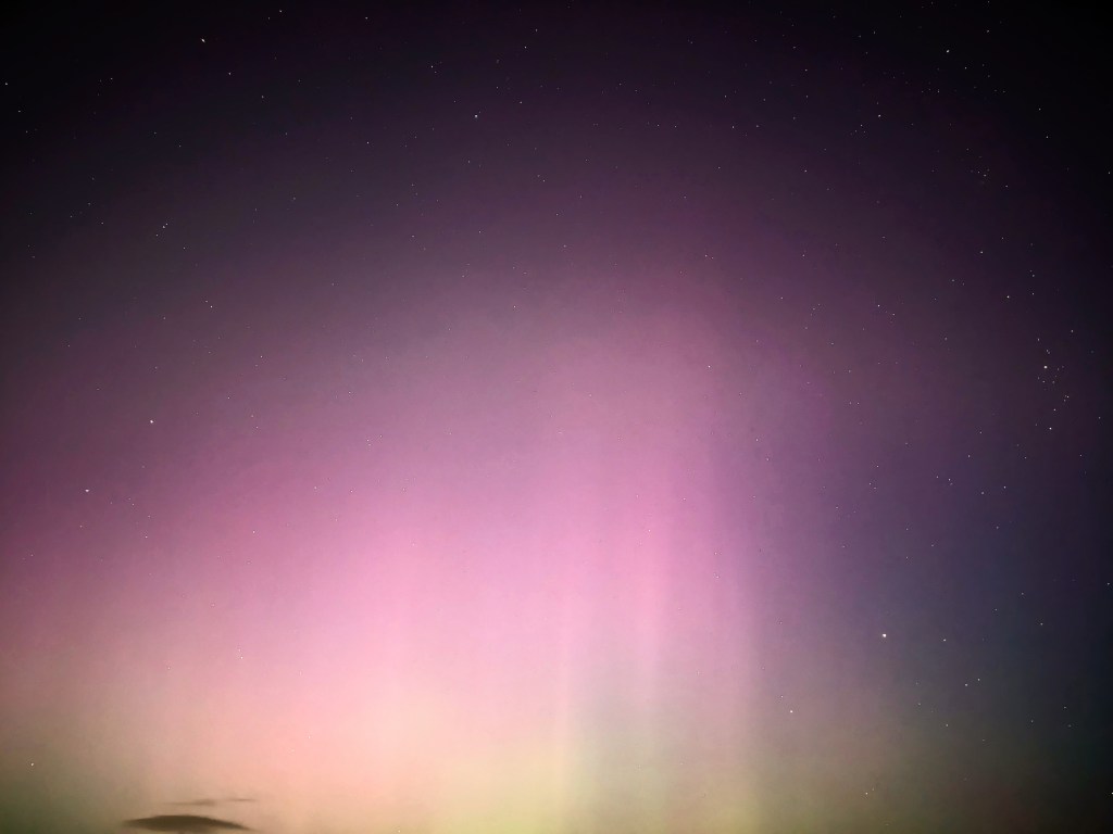 The pinks and yellows of the Northern Lights are seen above Cleethorpes on 5 November 2023.